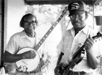 Joe and Odell Thompson playing old time music on the front porch
